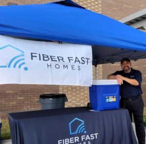 Fiber Fast Homes supporting Trinity Ranch Elementary Field Day with popsicles and community activities for local students.